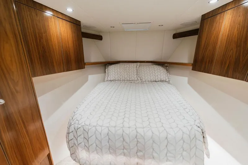 Slide: The Image of Luxurious cabin interior of 2021 Viking 58 Convertible yacht with elegant wood finishes. - 84