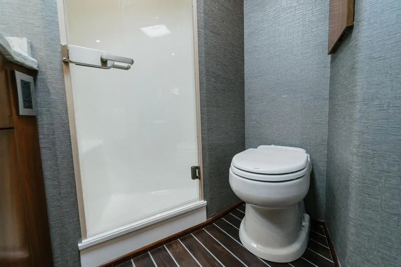 Slide: The Image of Bathroom interior of 2021 Viking 58 Convertible yacht with modern shower and toilet. - 89