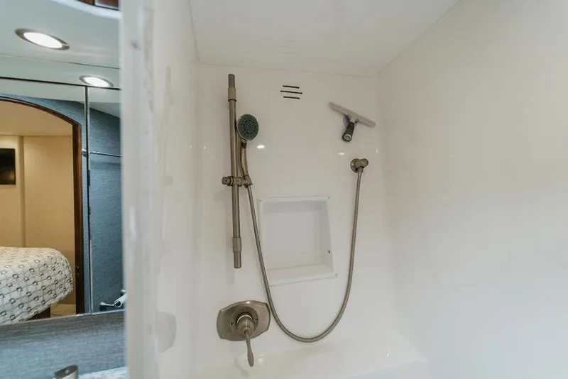 Slide: The Image of Shower area in 2021 Viking 58 Convertible yacht, featuring modern fixtures and sleek design. - 90