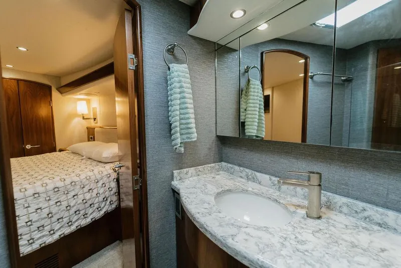 Slide: The Image of Luxurious bathroom and bedroom interior of 2021 Viking 58 Convertible yacht. - 91