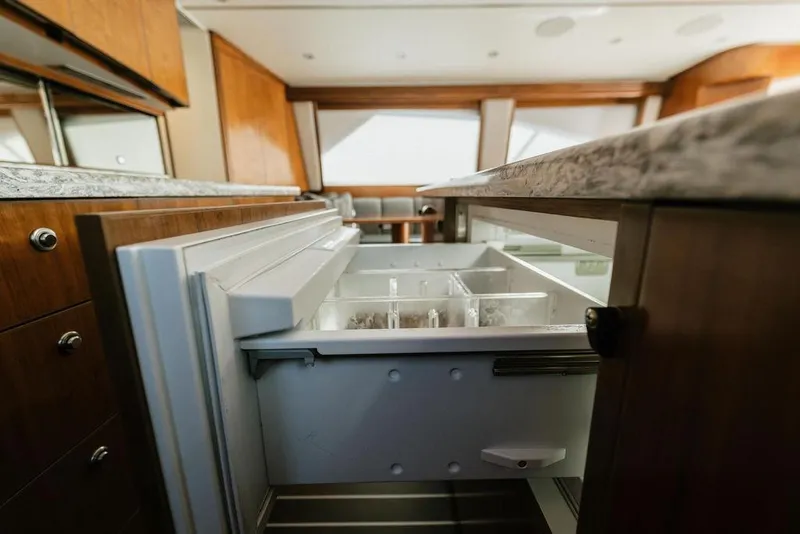 Slide: The Image of Luxury kitchen interior of 2021 Viking 58 Convertible yacht with open drawer. - 95