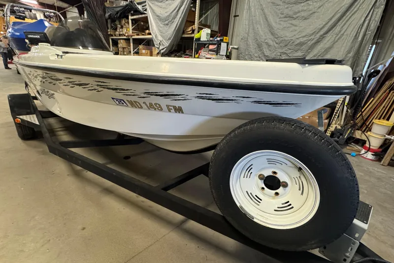 Slide: The Image of 2000 Yar-Craft 1785 Mille Lacs boat on trailer in garage setting. - 2