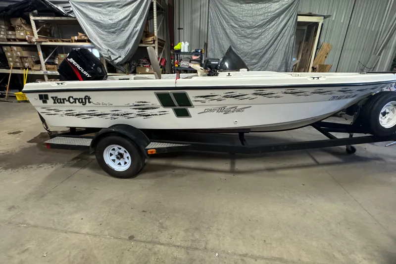 Slide: The Image of 2000 Yar-Craft 1785 Mille Lacs boat on trailer in warehouse setting. - 3