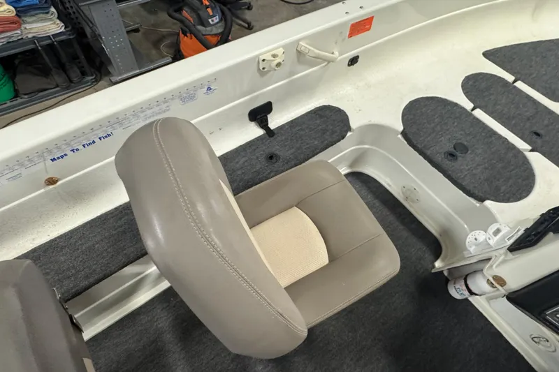 Slide: The Image of 2000 Yar-Craft 1785 Mille Lacs boat interior with beige seat and carpeted flooring. - 8