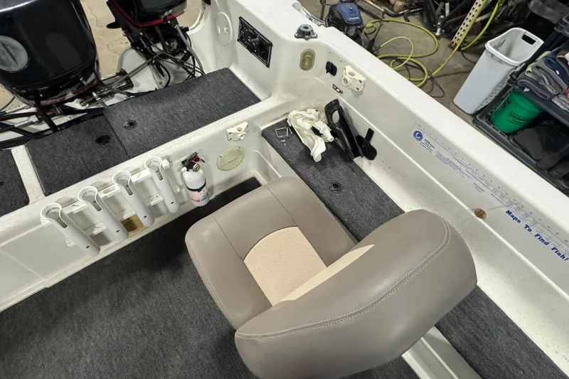 Slide: The Image of 2000 Yar-Craft 1785 Mille Lacs boat interior with seating and fishing rod holders. - 9