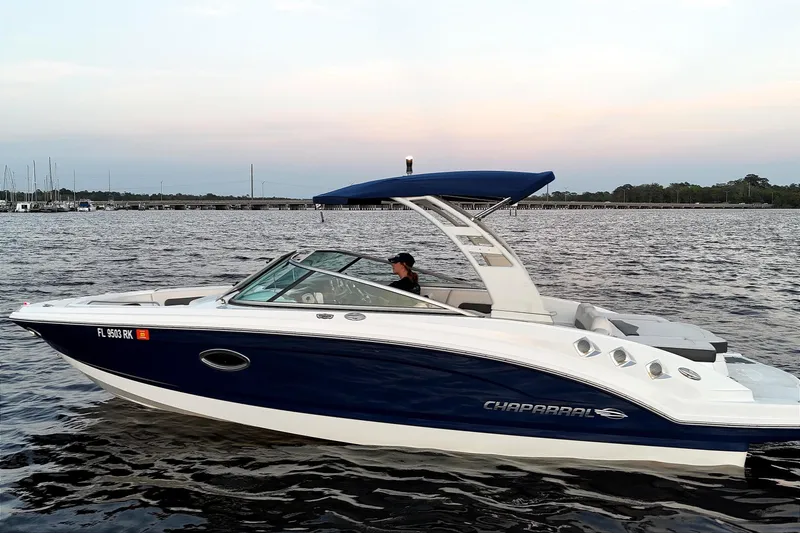 The Image of 2017 Chaparral 246 SSi boat on calm water at sunset. - 0