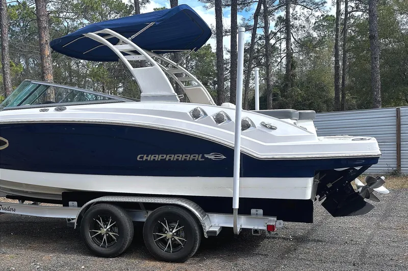 Slide: The Image of 2017 Chaparral 246 SSi boat parked on trailer outdoors. - 14