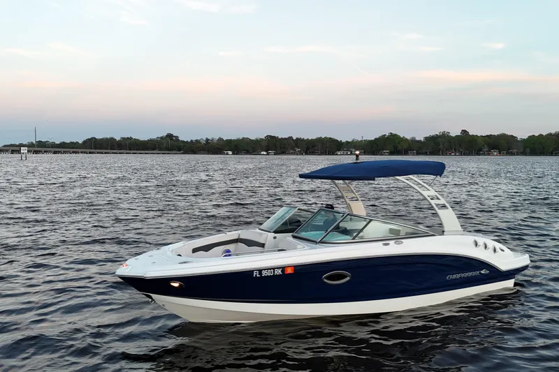 Slide: The Image of 2017 Chaparral 246 SSi boat on calm water at sunset. - 5
