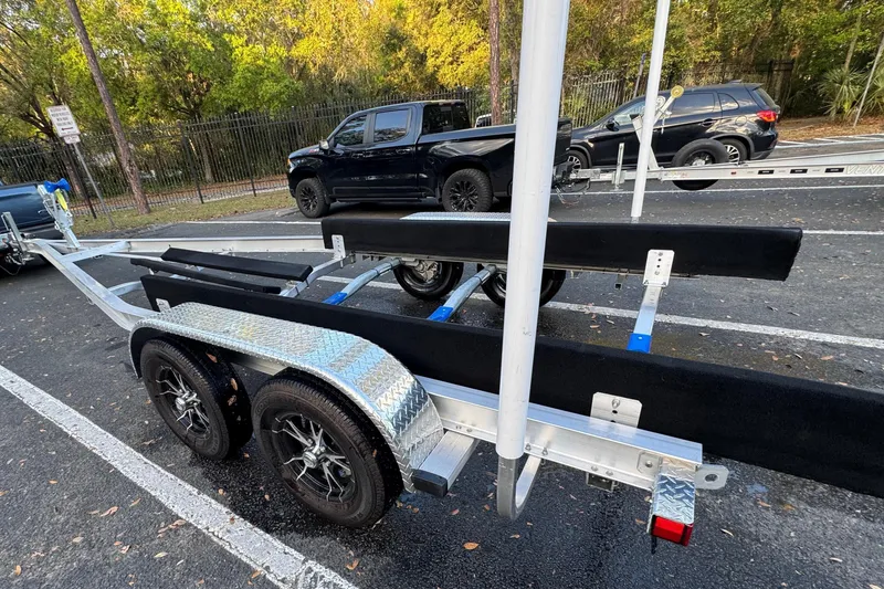 Slide: The Image of Boat trailer for 2017 Chaparral 246 SSi in parking lot. - 9
