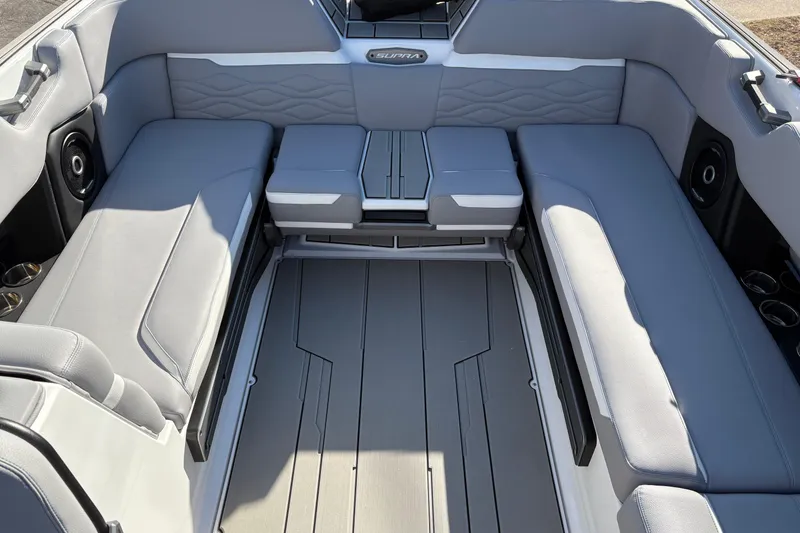 Slide: The Image of 2026 Supra SL 450 boat interior with gray seating and modern design. - 19