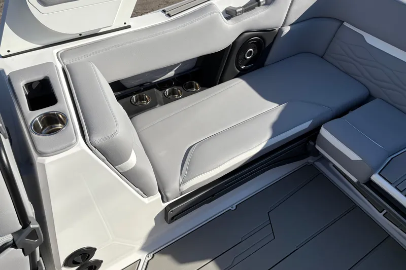 Slide: The Image of 2026 Supra SL 450 boat interior with gray seating and cup holders. - 20
