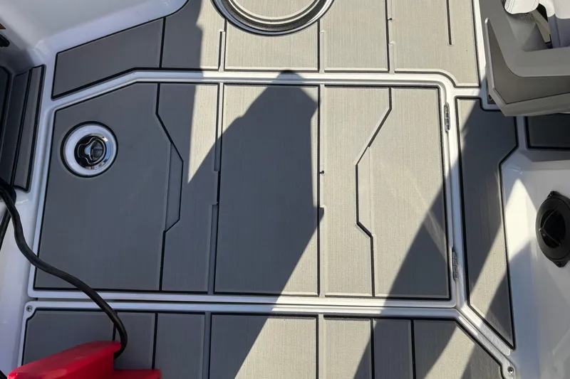 Slide: The Image of 2026 Supra SL 450 boat deck with sleek gray panels and modern design elements. - 33