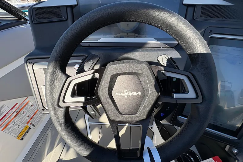 Slide: The Image of Steering wheel of 2026 Supra SL 450 boat with modern controls and dashboard. - 37