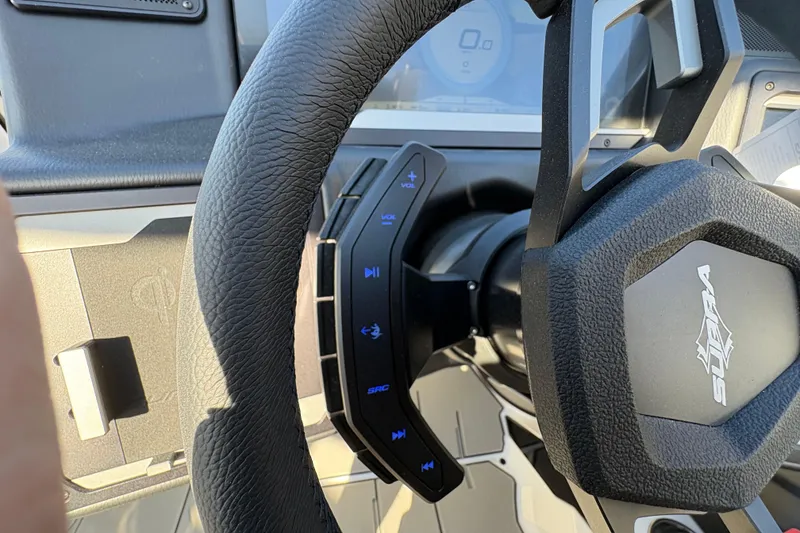 Slide: The Image of 2026 Supra SL 450 steering wheel with integrated controls and logo. - 39