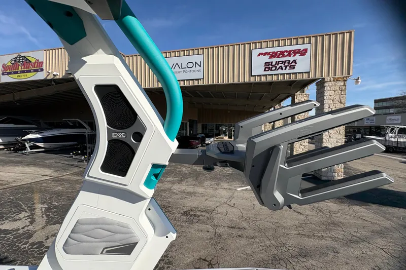 Slide: The Image of 2026 Supra SL 450 boat with advanced speaker system at dealership. - 44