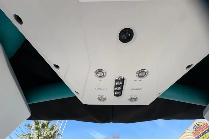 Slide: The Image of 2026 Supra SL 450 boat control panel with tower and bimini buttons. - 46