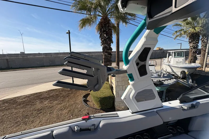 Slide: The Image of 2026 Supra SL 450 boat with advanced wakeboard rack and sleek design. - 49