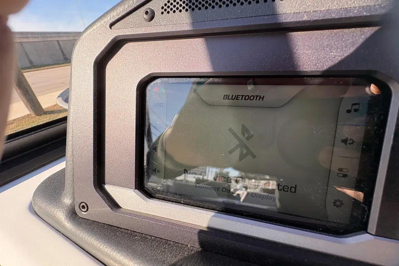 Slide: The Image of 2026 Supra SL 450 dashboard showing Bluetooth connectivity screen in sunlight. - 50