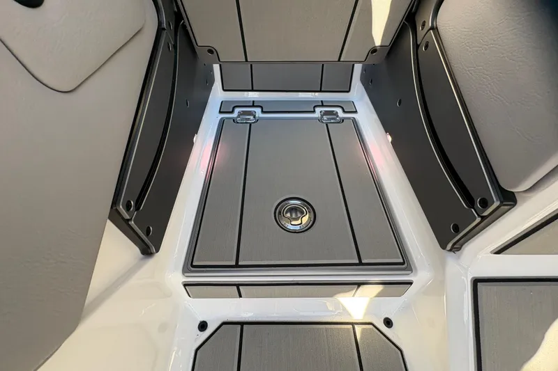 Slide: The Image of 2026 Supra SL 450 boat interior with sleek, modern design and storage compartment. - 55