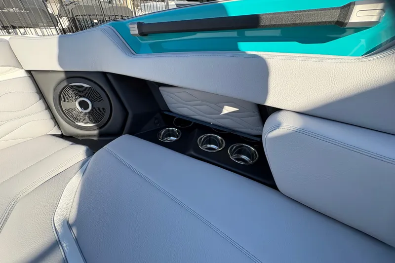 Slide: The Image of 2026 Supra SL 450 interior with speaker, cup holders, and stylish upholstery. - 58