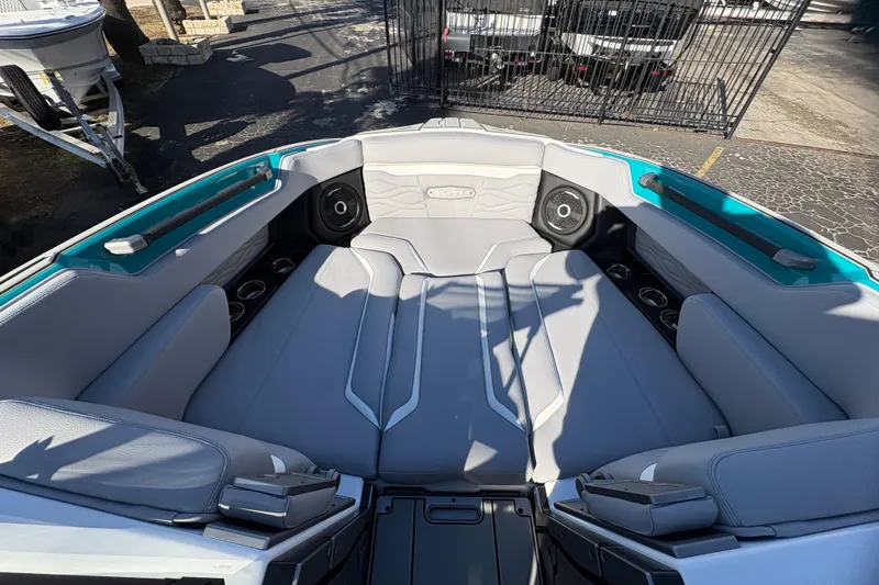 Slide: The Image of 2026 Supra SL 450 boat interior with gray seating and cup holders. - 60