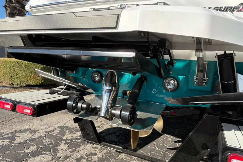 Slide: The Image of 2026 Supra SL 450 boat rear view showcasing propeller and trim tabs. - 9