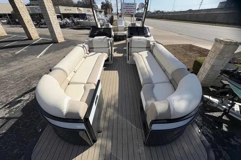 Slide: The Image of Luxurious 2026 Avalon Exalibur LTD 27 Elite pontoon boat with plush seating and modern design. - 12