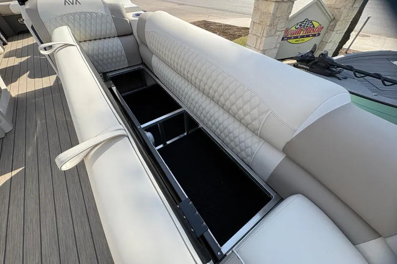 Slide: The Image of 2026 Avalon Exalibur LTD 27 Elite Winshield boat with open storage compartment and luxurious seating. - 14