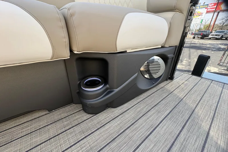 Slide: The Image of 2026 Avalon Exalibur LTD 27 Elite interior with cup holder and speaker detail. - 15