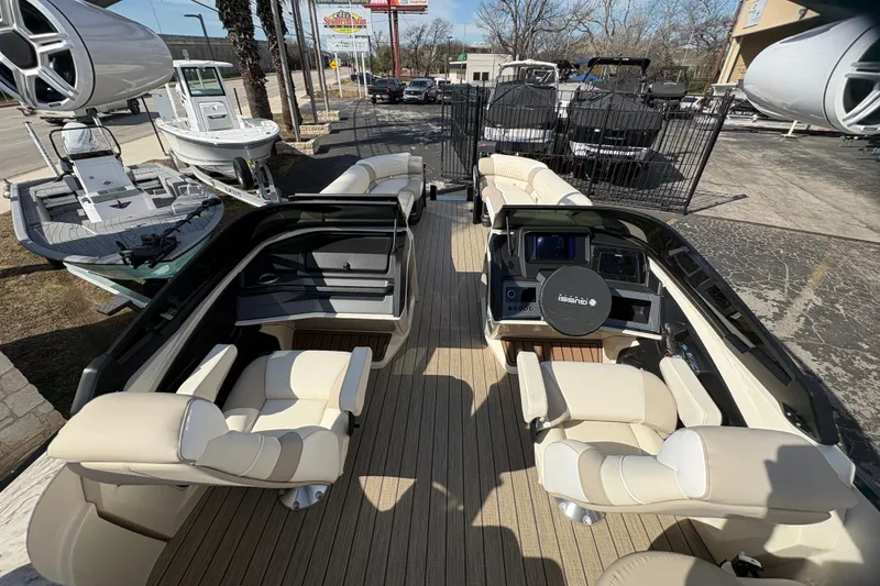 Slide: The Image of 2026 Avalon Exalibur LTD 27 Elite Windshield boat interior with luxurious seating and modern dashboard. - 17