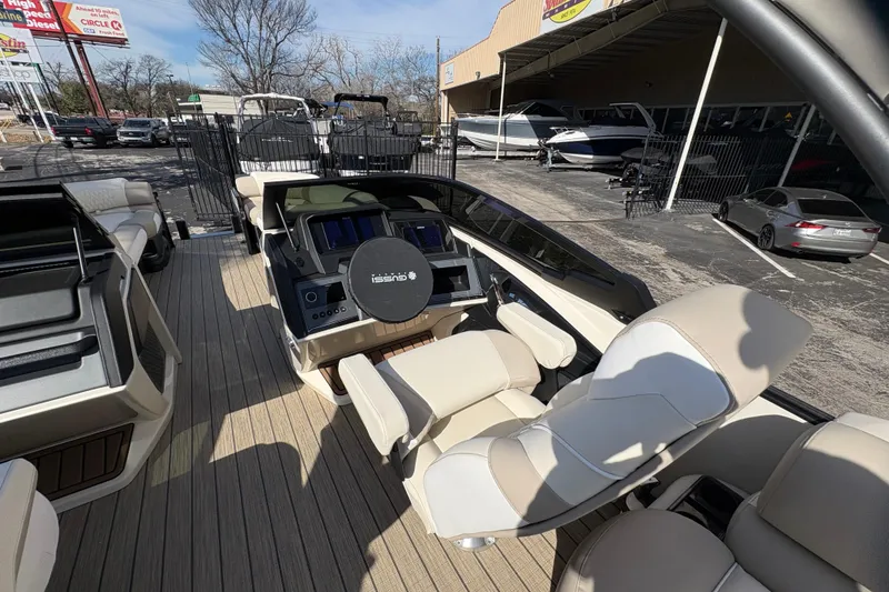 Slide: The Image of 2026 Avalon Exalibur LTD 27 Elite Winshield boat interior with modern dashboard and seating. - 21