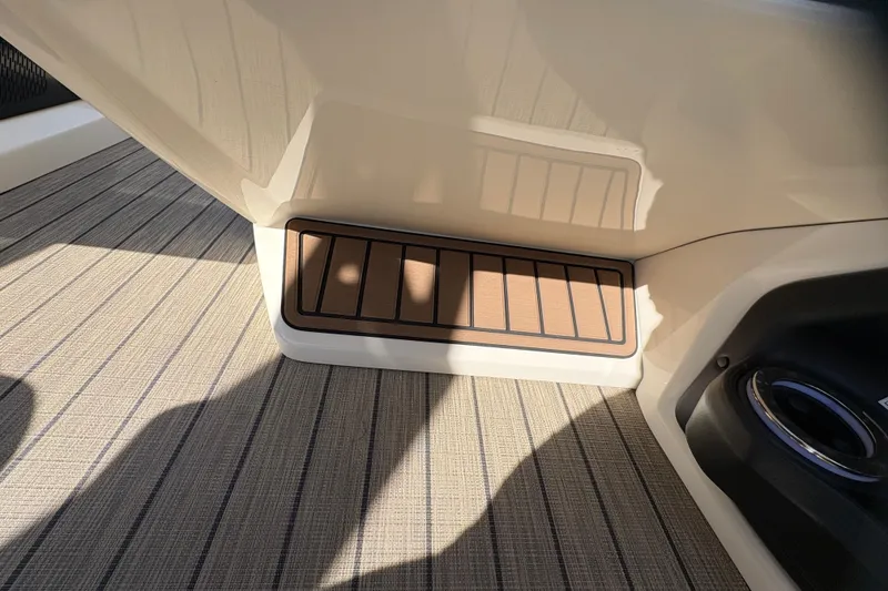 Slide: The Image of 2026 Avalon Exalibur LTD 27 Elite Winshield interior with stylish flooring and step detail. - 26