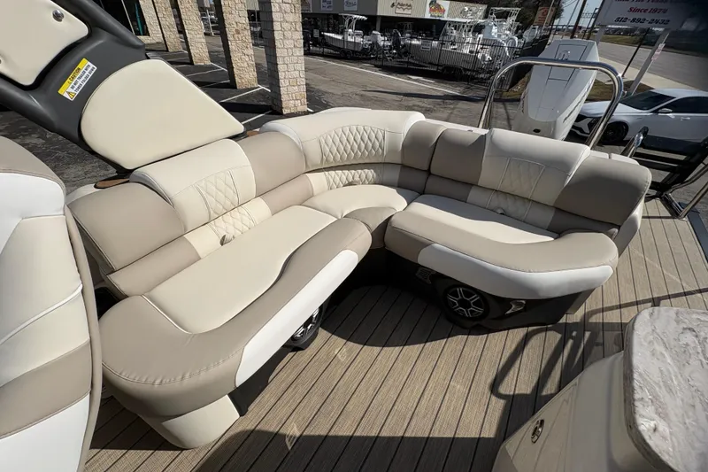 Slide: The Image of Luxurious seating on 2026 Avalon Exalibur LTD 27 Elite Winshield boat, featuring elegant beige upholstery. - 31