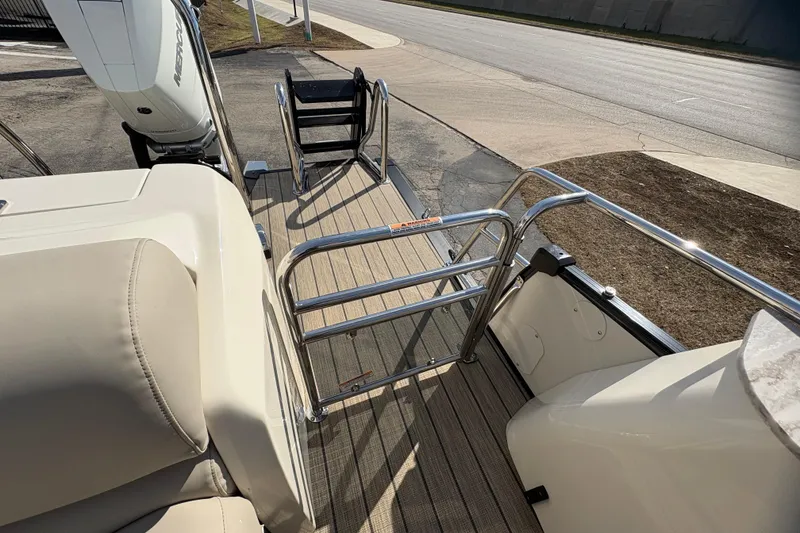 Slide: The Image of 2026 Avalon Exalibur LTD 27 Elite Winshield boat deck with railing and seating. - 41