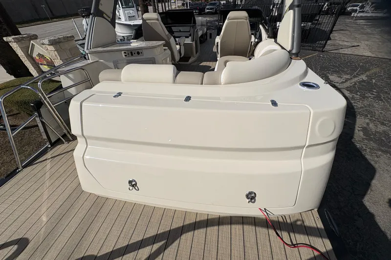 Slide: The Image of 2026 Avalon Exalibur LTD 27 Elite Winshield boat interior with beige seating and deck. - 43