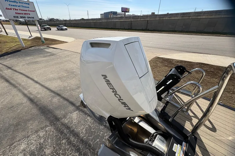 Slide: The Image of 2026 Avalon Exalibur LTD 27 Elite with Mercury outboard motor on a sunny day. - 46