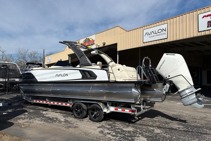Slide: The Image of 2026 Avalon Exalibur LTD 27 Elite Windshield luxury pontoon boat on trailer. - 5
