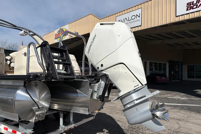 Slide: The Image of 2026 Avalon Exalibur LTD 27 Elite with Mercury outboard at dealership. - 6
