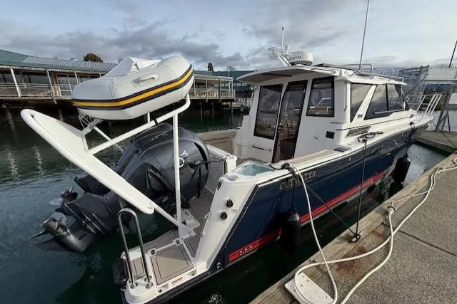 Slide: The Image of 2026 Cutwater C-288 Coupe boat docked with inflatable dinghy on stern. - 3