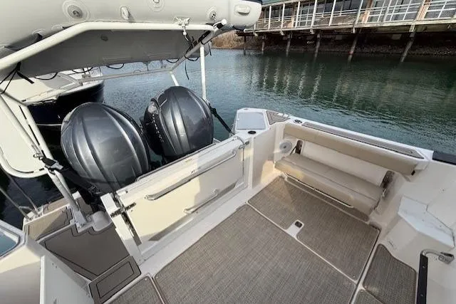 Slide: The Image of 2026 Cutwater C-288 Coupe boat interior with twin engines and spacious deck area. - 4