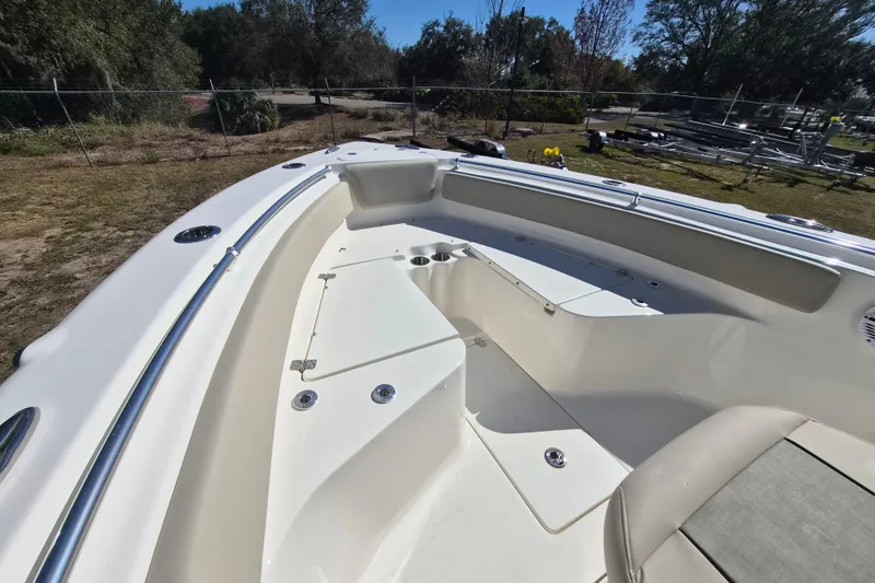 Slide: The Image of 2026 Key West 239 FS boat interior with seating and storage compartments. - 10