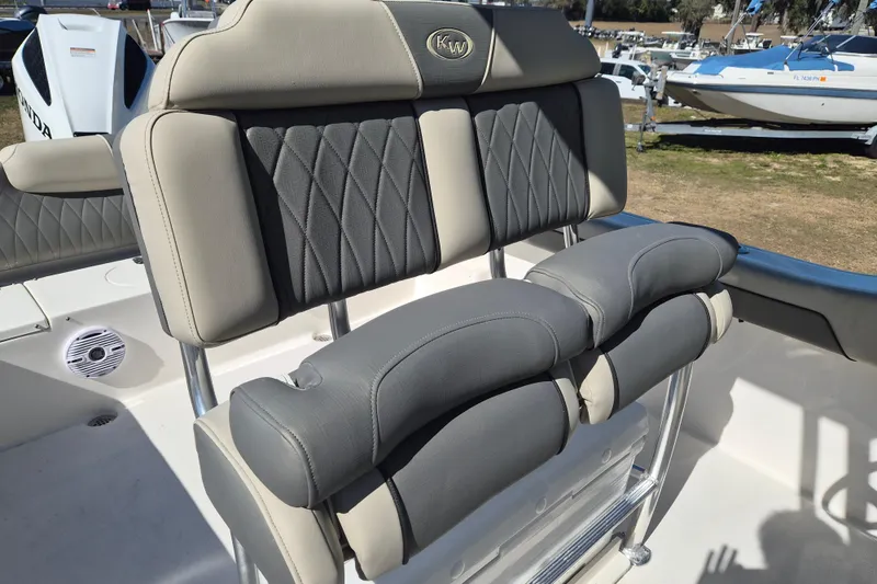 Slide: The Image of 2026 Key West 239 FS boat seating with cushioned backrest and armrests. - 3