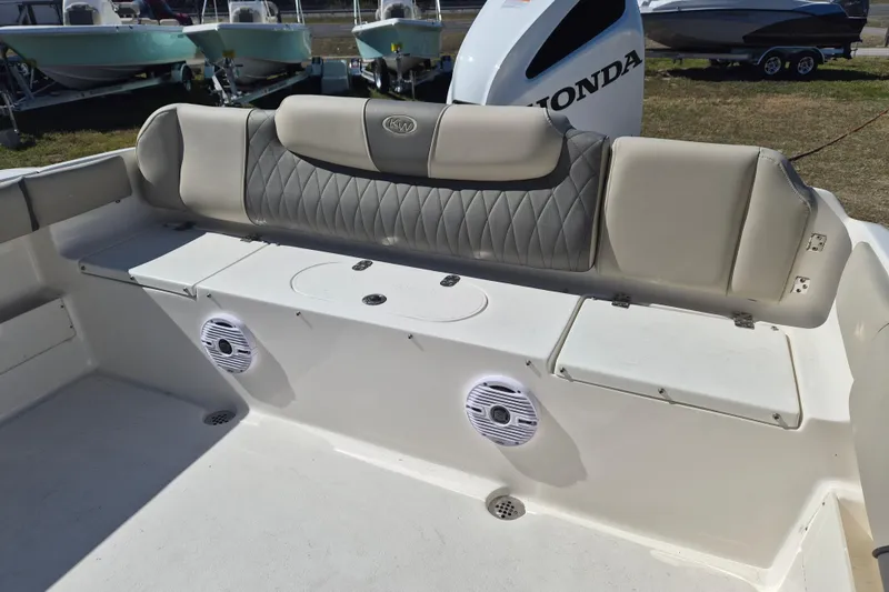 Slide: The Image of 2026 Key West 239 FS boat interior with cushioned seating and speakers. - 4