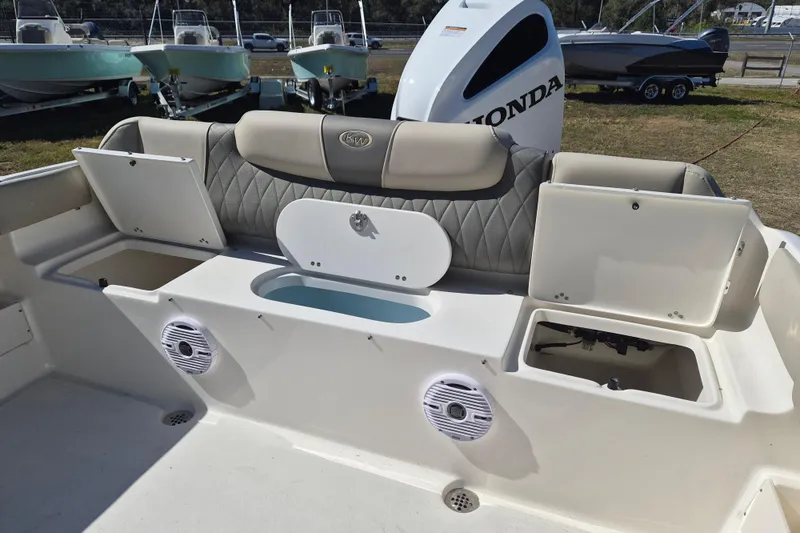Slide: The Image of 2026 Key West 239 FS boat interior with storage compartments and Honda engine. - 5