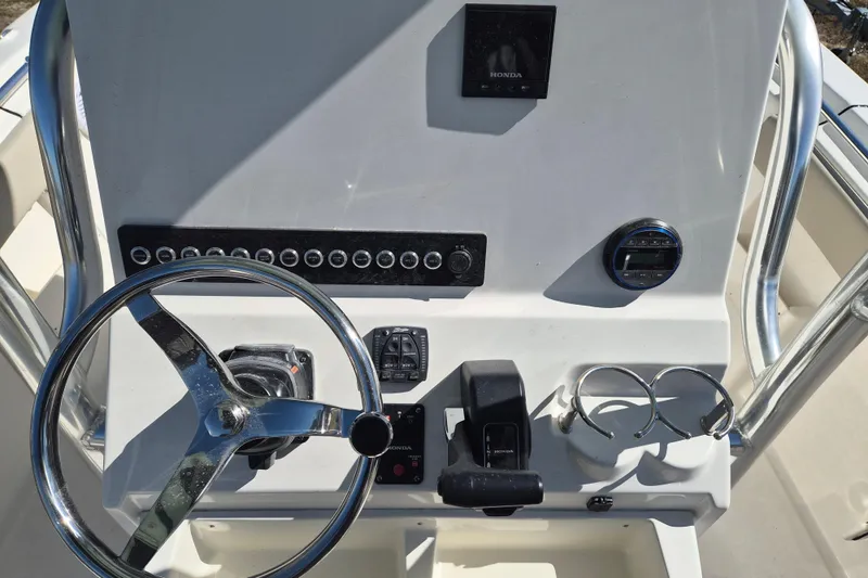 Slide: The Image of 2026 Key West 239 FS boat dashboard with steering wheel and controls. - 7