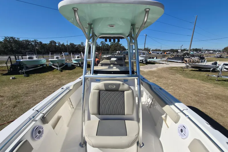 Slide: The Image of 2026 Key West 239 FS boat with seating and T-top, displayed outdoors. - 9