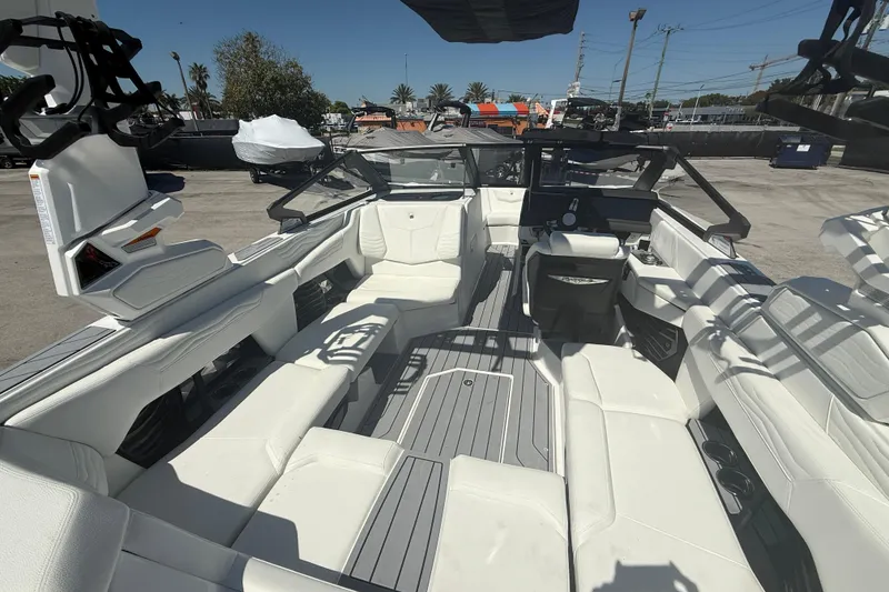 Slide: The Image of 2026 Nautique Super Air Nautique G21 interior with luxurious seating and modern design. - 14