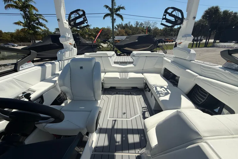 Slide: The Image of 2026 Nautique Super Air Nautique G21 boat interior with white seating and modern design. - 16