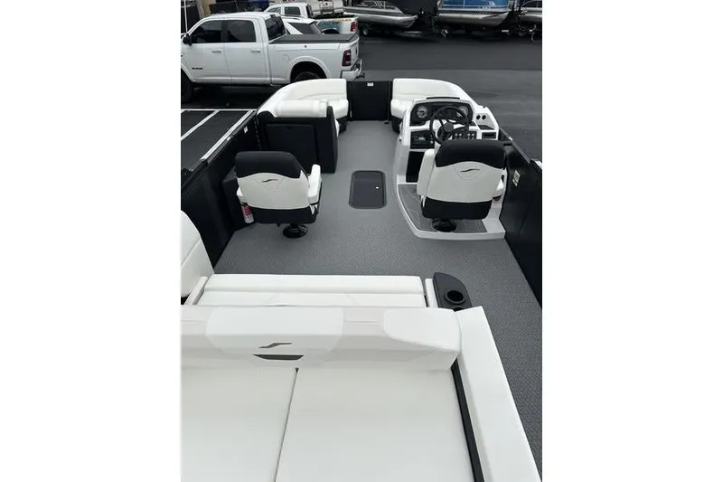 Slide: The Image of 2026 EVOTTTI 523CS boat interior with white seating and modern dashboard. - 19
