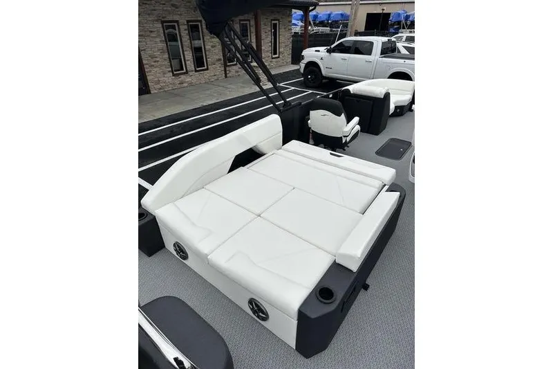 Slide: The Image of 2026 EVOTTTI 523CS boat interior with white seating and modern design. - 20